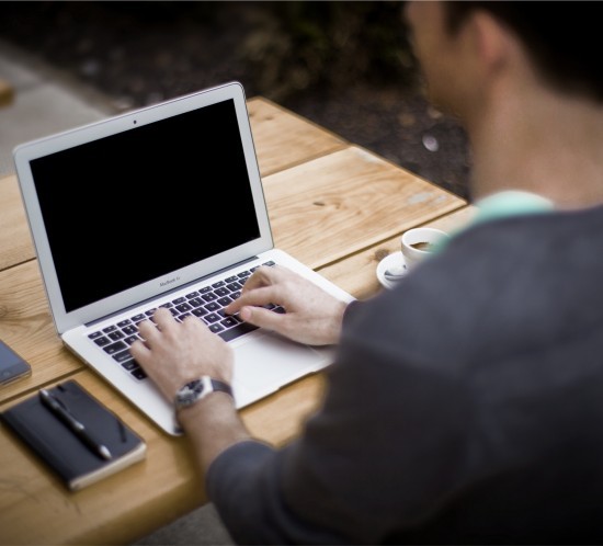 Man sitting at laptop